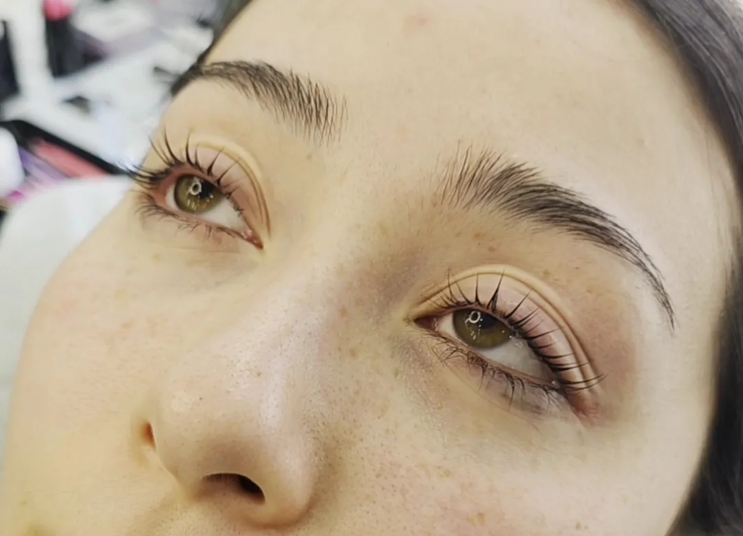 Lifted lashes and groomed brows close-up