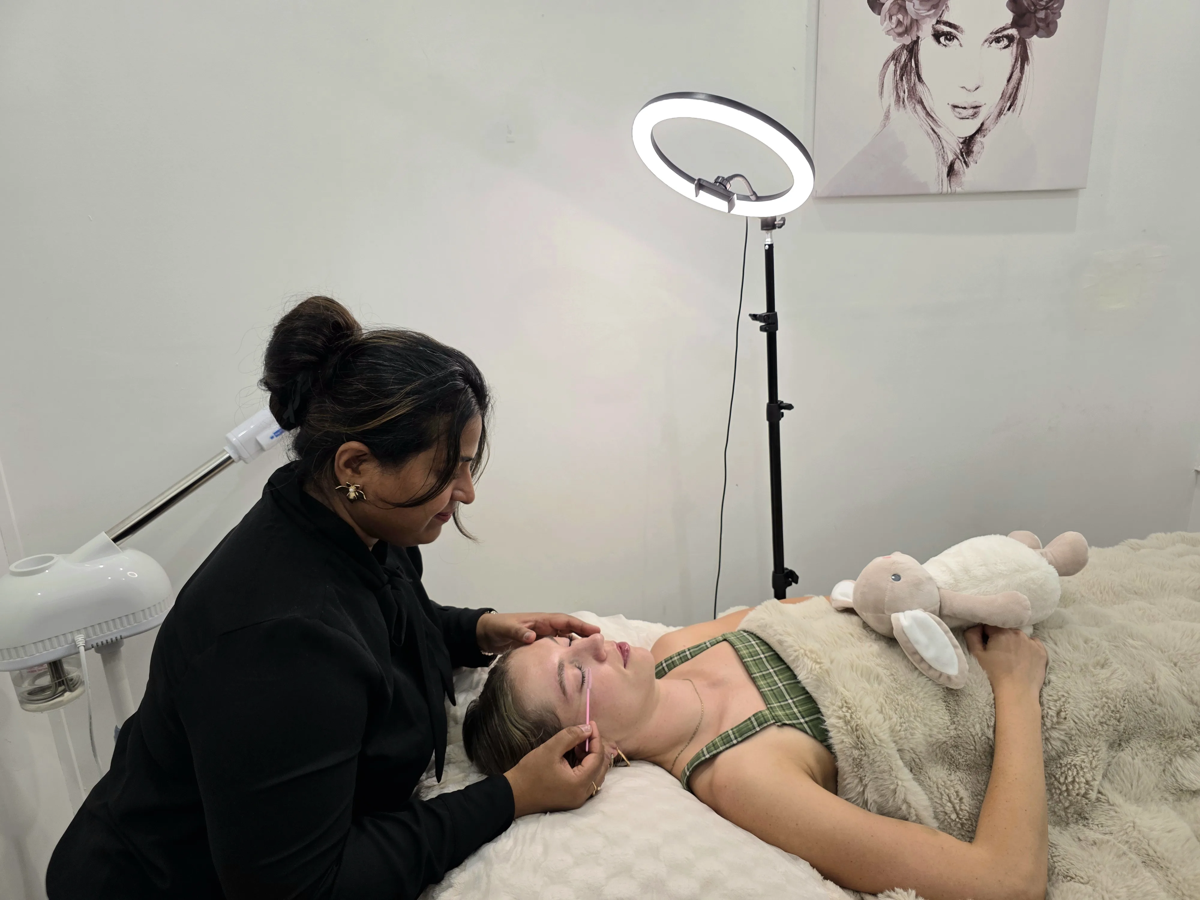 Lash treatment being performed in the private treatment room